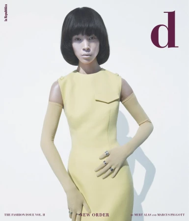 Fashion magazine cover featuring an Asian female model in a pale yellow dress and matching gloves, posing against a plain white backdrop.