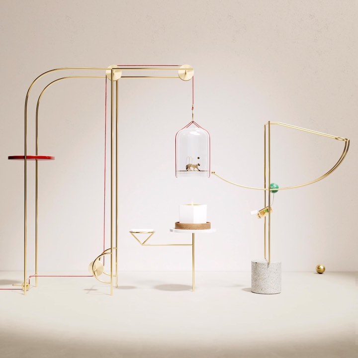 Abstract still life: Geometric metallic structures display small objects, arranged against a cream backdrop with minimalist composition.