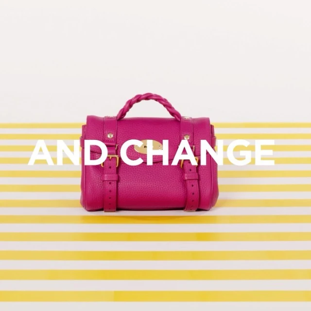 Fuchsia Mulberry handbag on a striped yellow and white surface, showcasing fashion accessory details in a studio product shot.