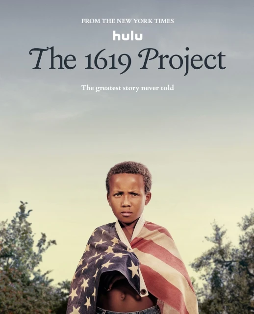 A young Black boy with serious expression draped in an American flag stands outdoors against a hazy sky, advertising 'The 1619 Project' on Hulu.