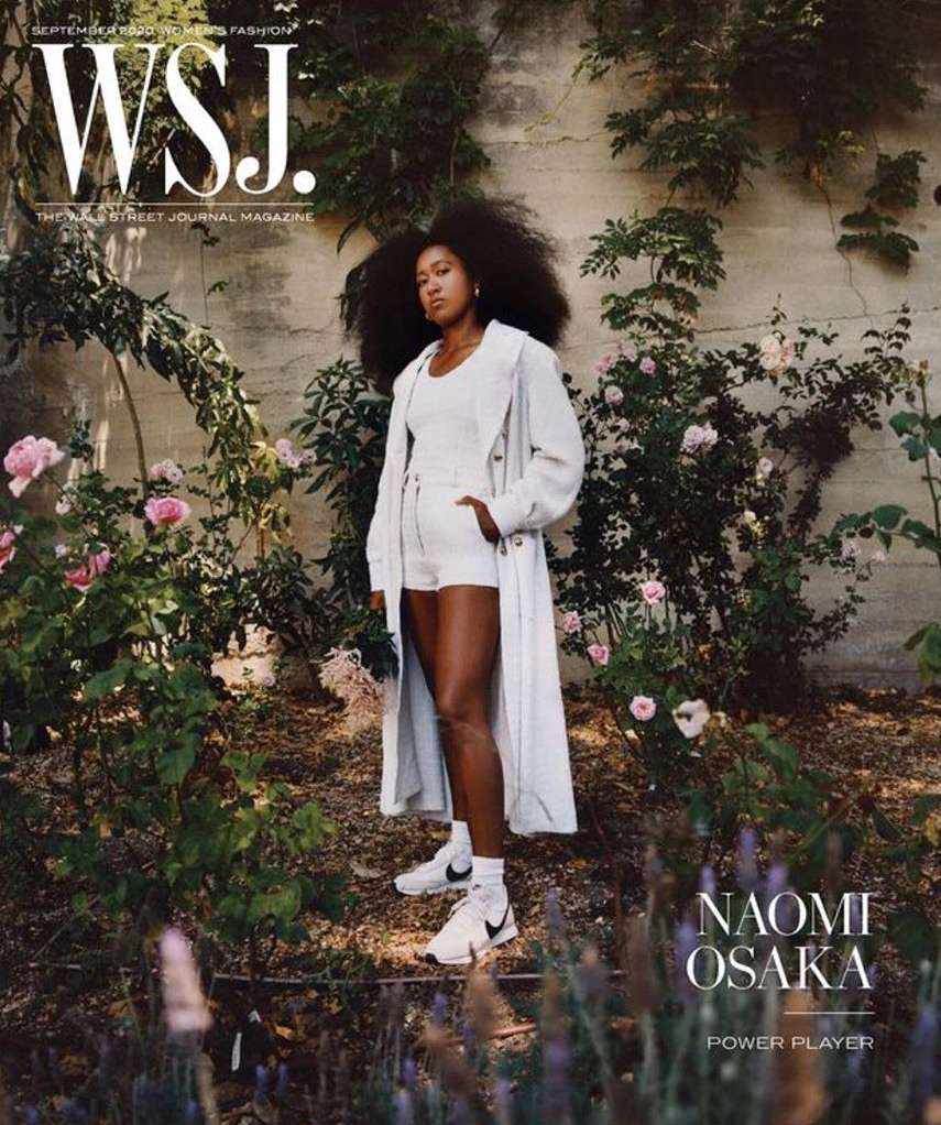 Magazine cover featuring Naomi Osaka in a white outfit and trench coat, posing outdoors with flowers and greenery. WSJ logo is visible.