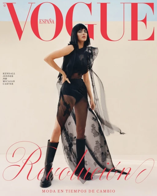 Vogue España cover featuring Kendall Jenner in black lace dress and boots, posing in a desert setting with red Vogue logo.