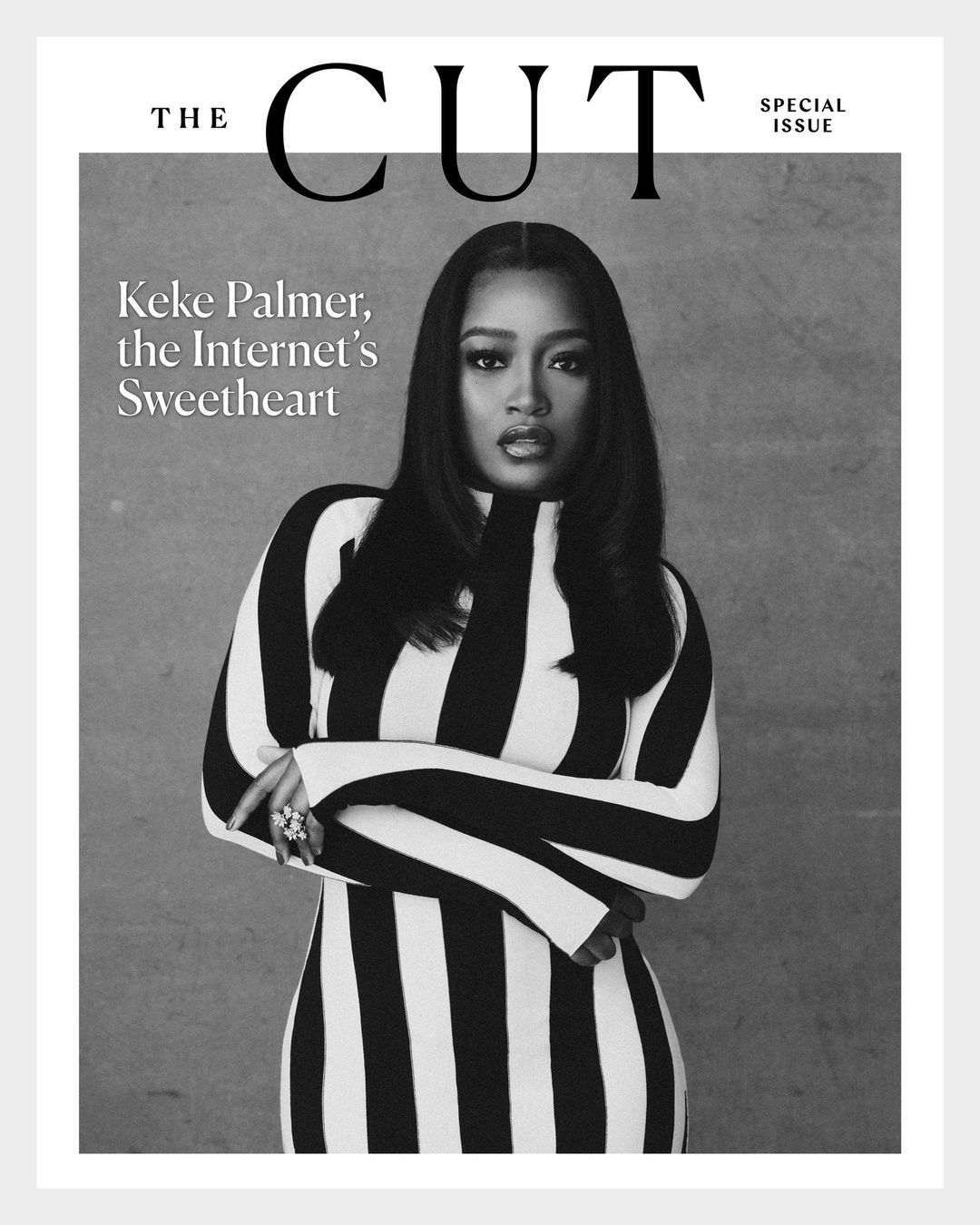 Black and white portrait of Keke Palmer on The Cut magazine cover, wearing a striped dress and jewelry, against a grey backdrop.