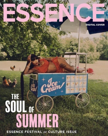 Essence magazine cover featuring a woman in orange lingerie lying on a blue ice cream cart in a grassy outdoor setting.