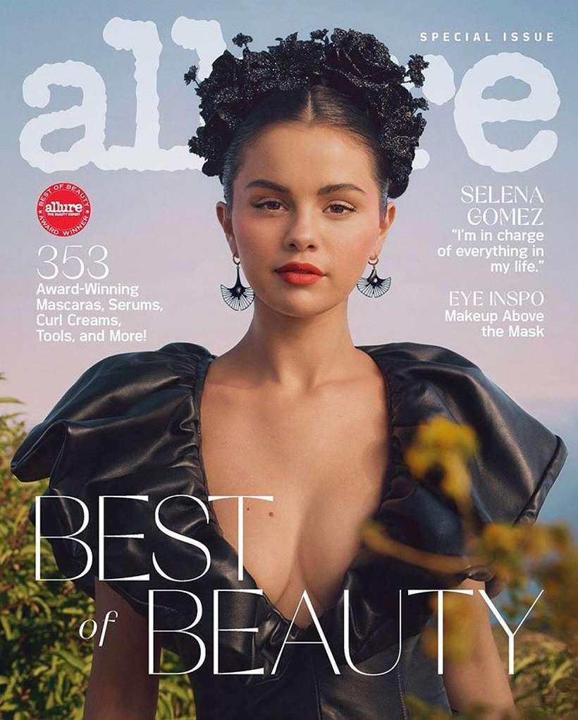 Allure magazine cover featuring Selena Gomez, who is wearing a black dress, flower headpiece, and dangling earrings in an outdoor setting.