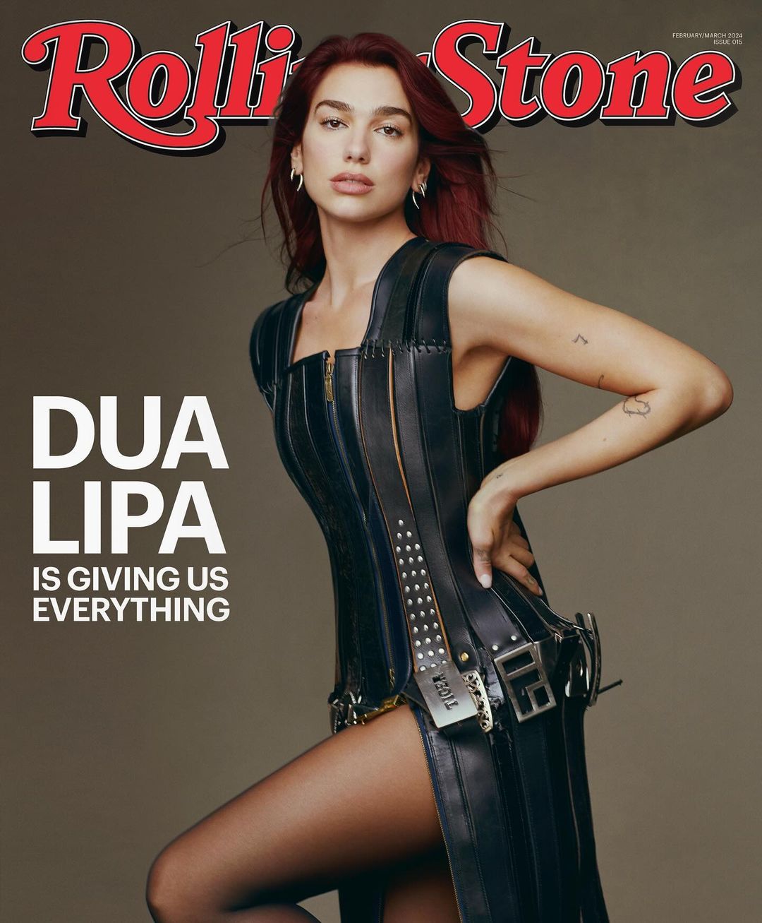 Dua Lipa cover Rolling Stone Magazine, posing in black dress. The singer looks at the camera with neutral facial expression.