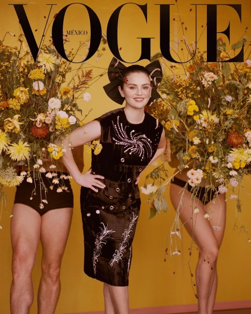 Vogue Mexico cover featuring Selena Gomez in an embellished black dress, surrounded by floral arrangements, against a yellow backdrop.