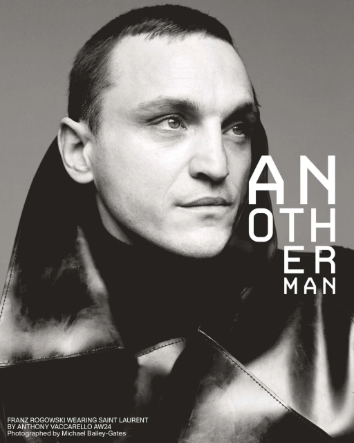Headshot of Franz Rogowski in leather coat for Another Man, wearing Saint Laurent AW24, photographed by Michael Bailey-Gates. Black and white.