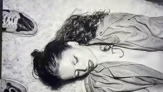 Illustration of a reclining adult female with curly hair, wearing a jacket, with sneakers nearby, in a monochromatic color scheme.
