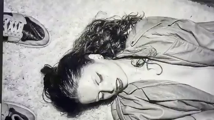 Illustration of a reclining adult female with curly hair, wearing a jacket, with sneakers nearby, in a monochromatic color scheme.