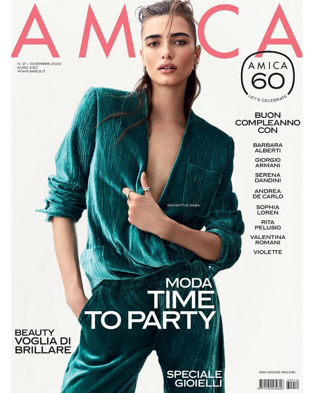 Magazine cover featuring a woman in a teal velvet suit; Amica brand logo at the top and article titles in white and black text.