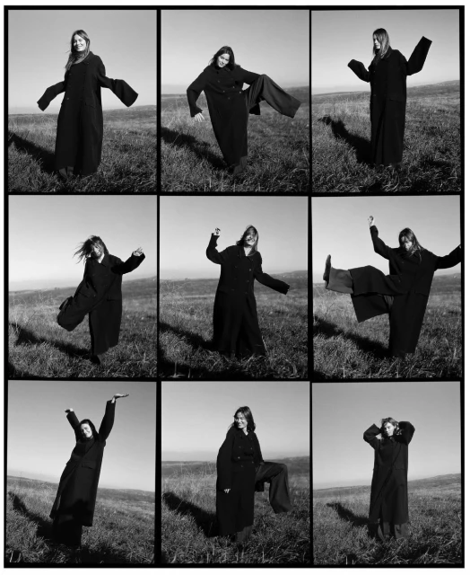 Black-and-white fashion shot featuring a young woman in a long black coat posing in various expressive poses in a grassy field.