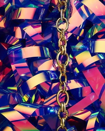A gold chain necklace is centered over a geometric background of vibrant blue, yellow and pink glossy confetti shapes.