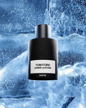Tom Ford Ombré Leather Parfum bottle on textured ice surface, studio shot, cool blue tones, minimalist product photography, fragrance concept.