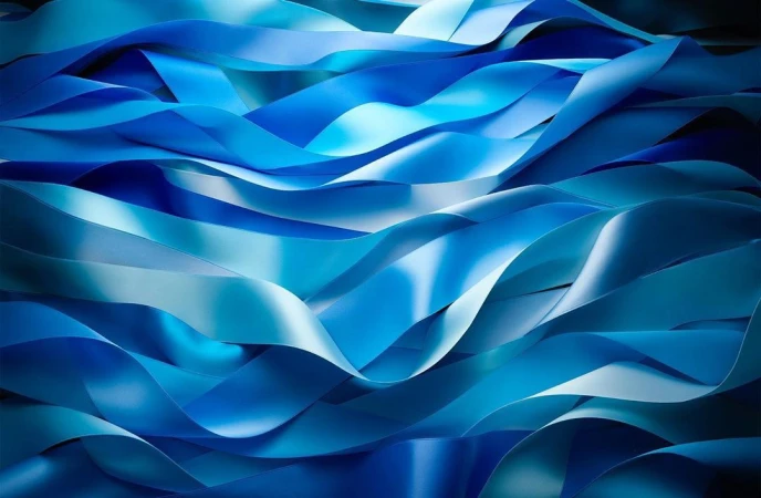 Close-up of overlapping wavy blue fabric ribbons creating abstract curves and shadows