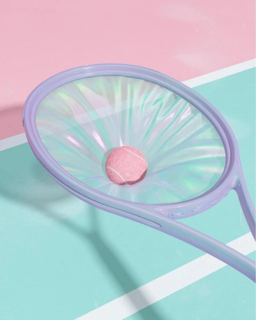 Pastel color photo of a tennis racket with holographic strings and a fuzzy pink tennis ball, set against a split pink and teal background.
