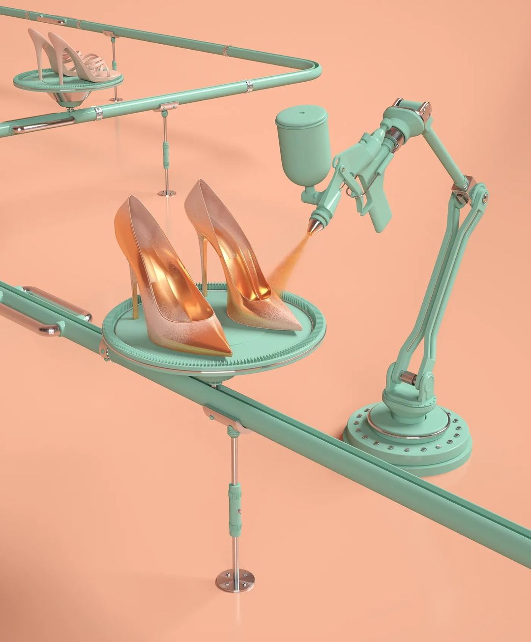 High heel shoes are being sprayed with gold color using a robotic arm on a turquoise platform against a peach-colored backdrop.