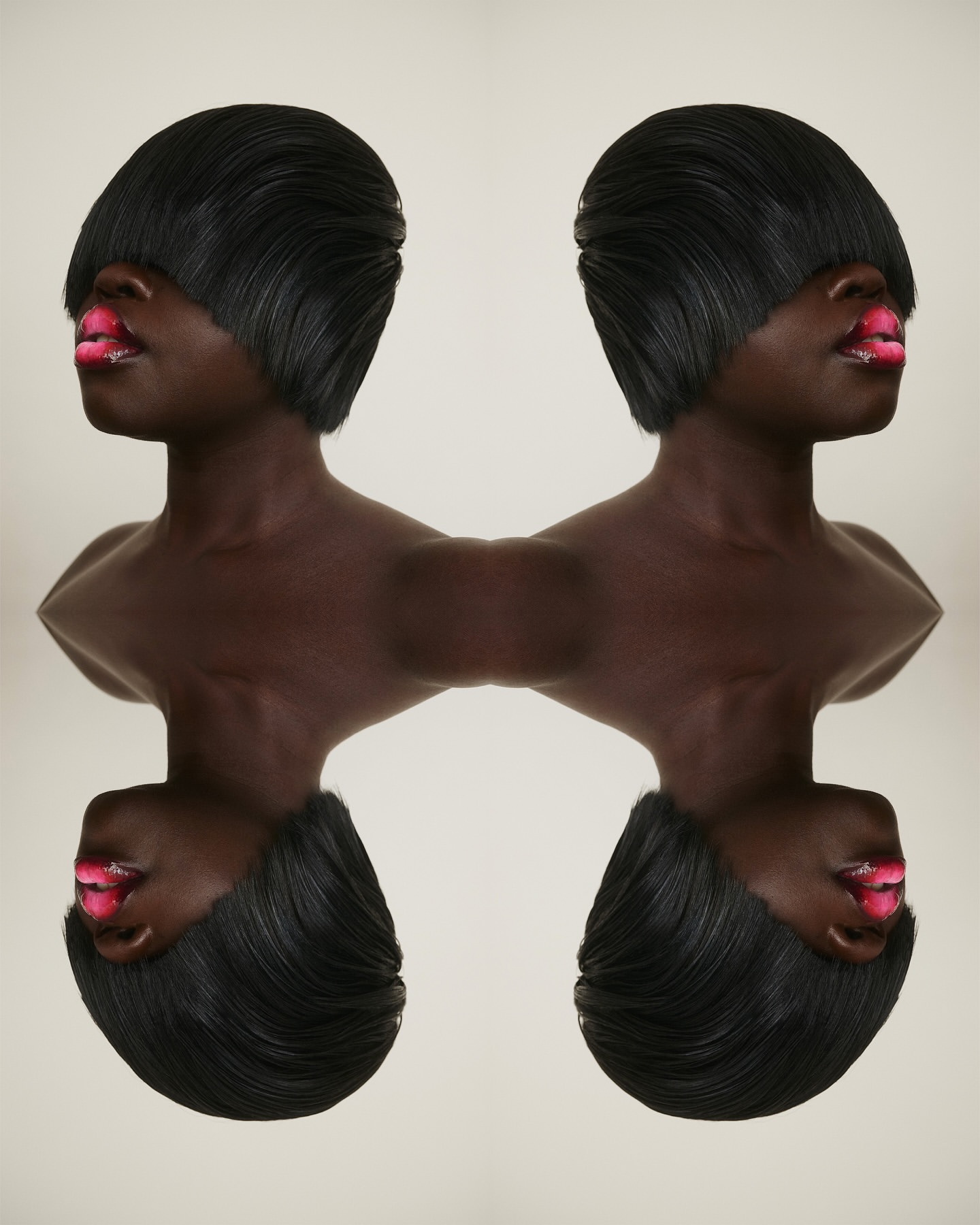 Abstract portrait with two dark-skinned women with matching bob haircuts and bright pink lipstick, mirrored against a plain background.