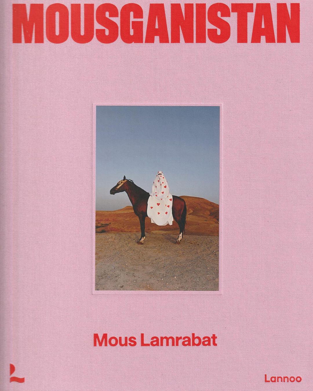 Book cover with the word MOUSGANISTAN at the top.  A brown horse is carrying a rider with a white cloth and red hearts.