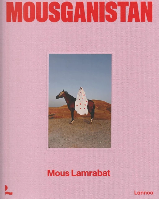 Book cover with the word MOUSGANISTAN at the top.  A brown horse is carrying a rider with a white cloth and red hearts.