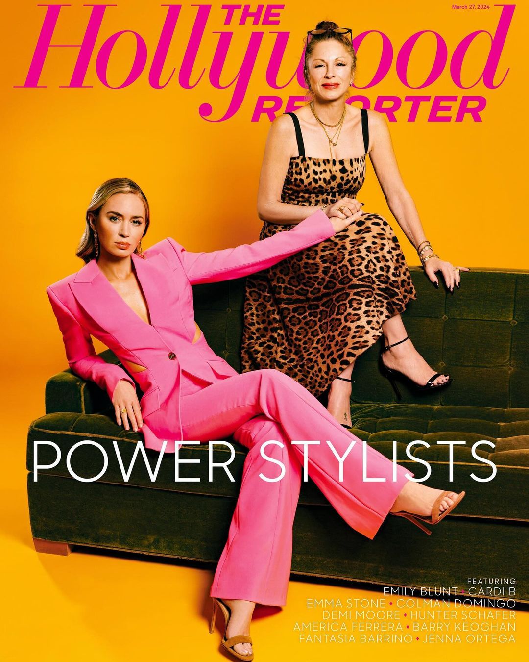 Two women, one in pink pantsuit, the other in leopard print dress, pose on a green couch for the Hollywood Reporter magazine cover.
