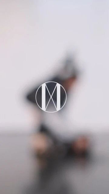 Abstract motion blur effect of a human figure against a white backdrop, creating a dynamic and artistic visual. 