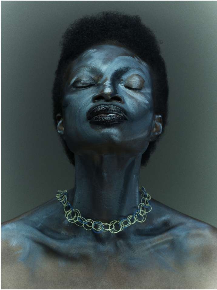 Portrait of African American woman with closed eyes, face paint, and necklace against a dark grey background in a close-up shot.