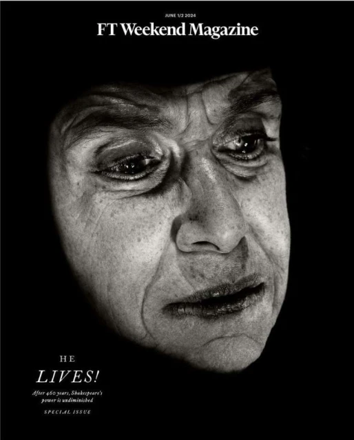Black-and-white magazine cover features the close-up portrait of an older man with deep wrinkles, set against a stark, dark background.