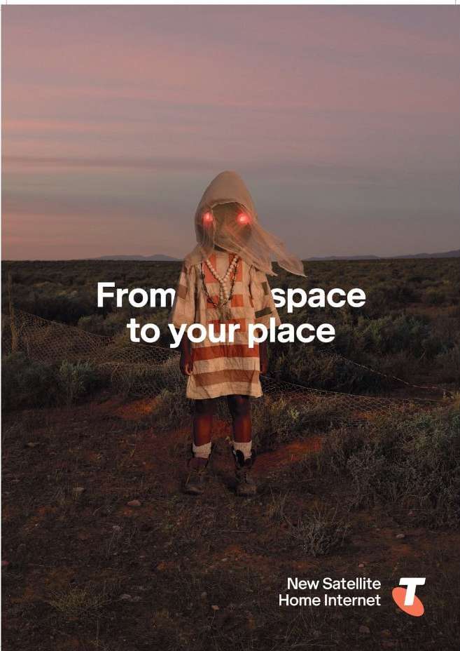 Person in hooded outfit stands in a field at dusk. This image features a blend of nature and mysterious fashion elements, set against a twilit sky.