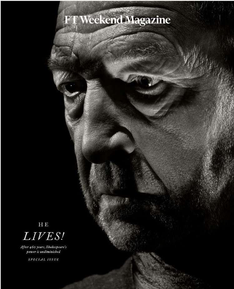 Striking black and white close-up portrait of an older adult male, with the top of a magazine visible in the composition.