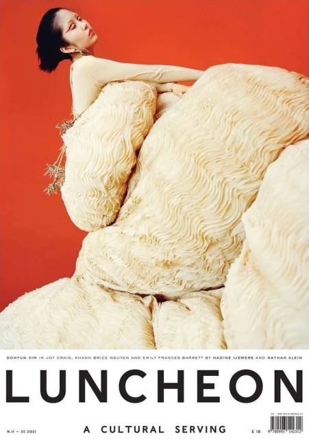 Fashion magazine cover featuring an Asian woman in sculptural white outfit against a red background, promoting the 'Luncheon' publication.