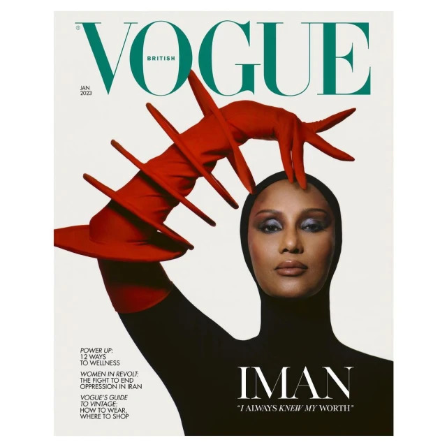 British Vogue cover featuring Iman in a black bodysuit and red avant-garde glove, against a clean white backdrop, January 2023 issue.