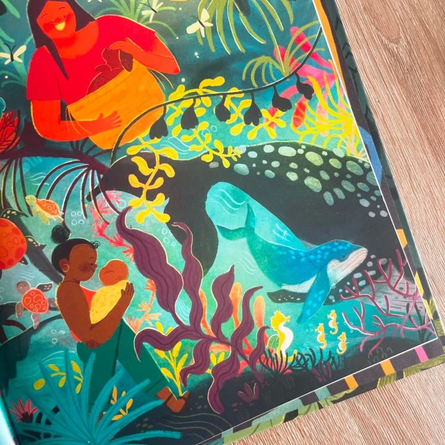 Illustration of two women, one holding a baby, surrounded by lush vegetation, sea turtles, and whales, creating a vibrant, natural scene.