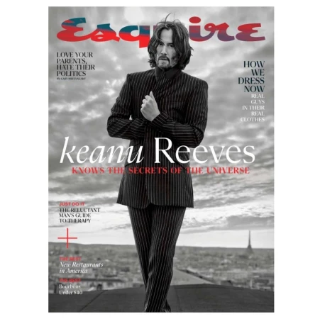Magazine cover featuring Keanu Reeves in a pinstripe suit against a monochrome cityscape backdrop, with the 'Esquire' logo displayed.