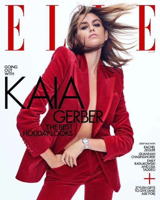 Magazine cover featuring Kaia Gerber in a red velvet suit, against a white background. ELLE logo and cover text are visible.