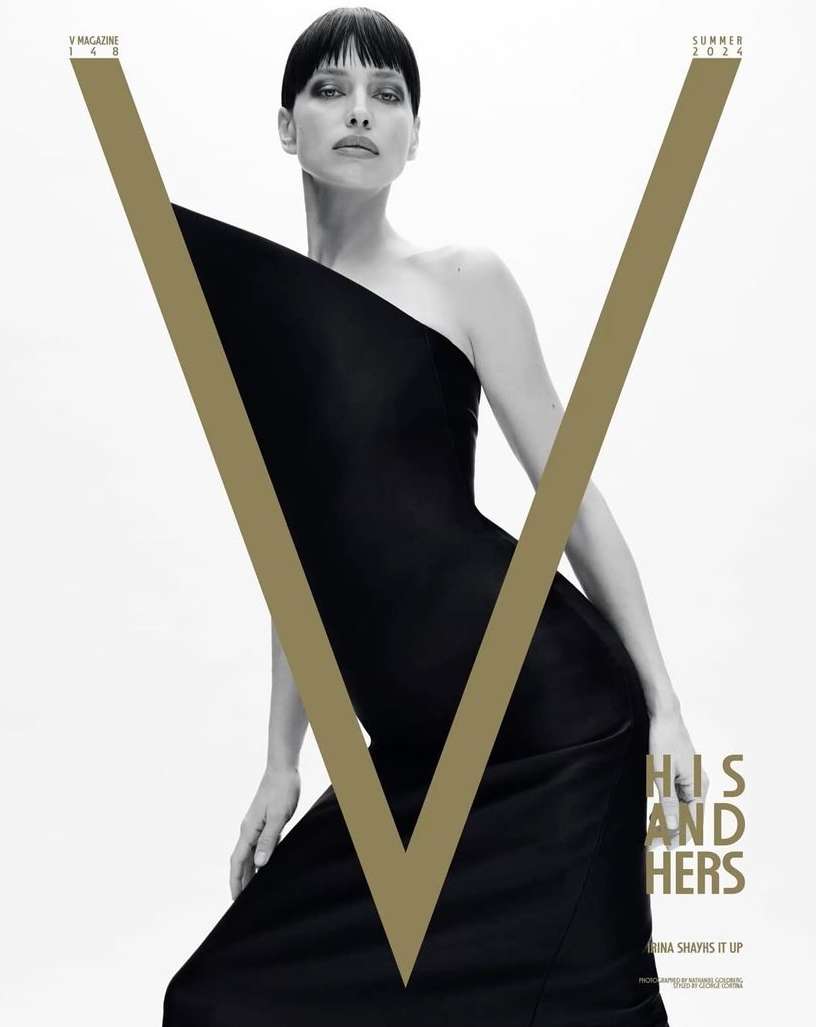 V Magazine cover featuring a woman in a black dress with gold V logo, shot in a photo studio with bright, even lighting.
