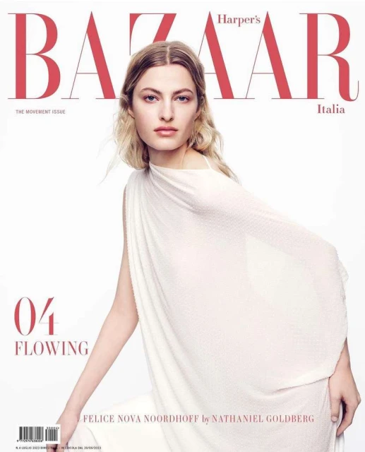 Felice Nova Noordhoff graces the cover of Harper's Bazaar Italia, wearing a flowing white dress against a clean, white background.