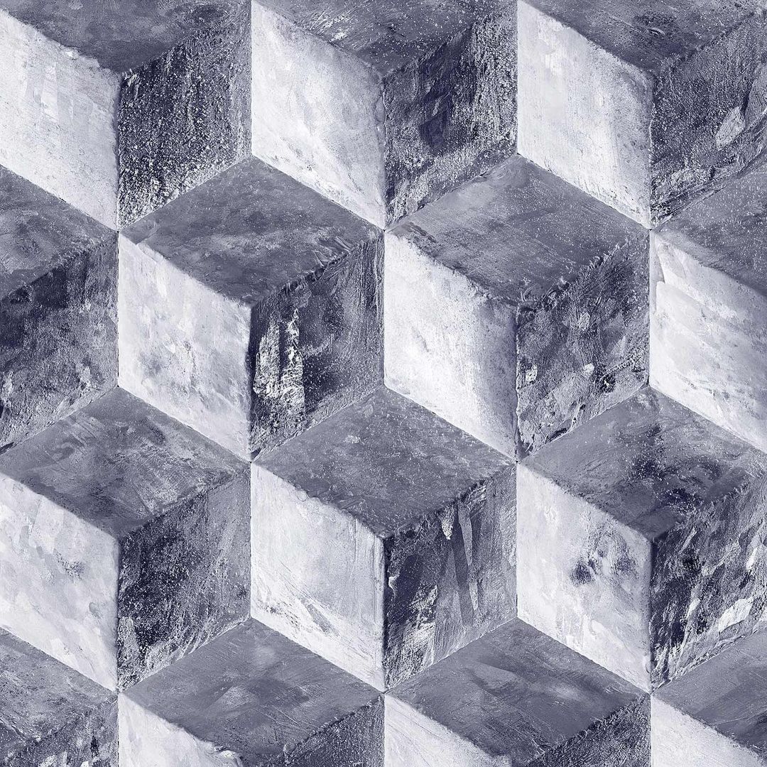 Abstract geometric pattern with cube shapes arranged in a monochrome gray-blue color scheme, creating a textured and dimensional surface.