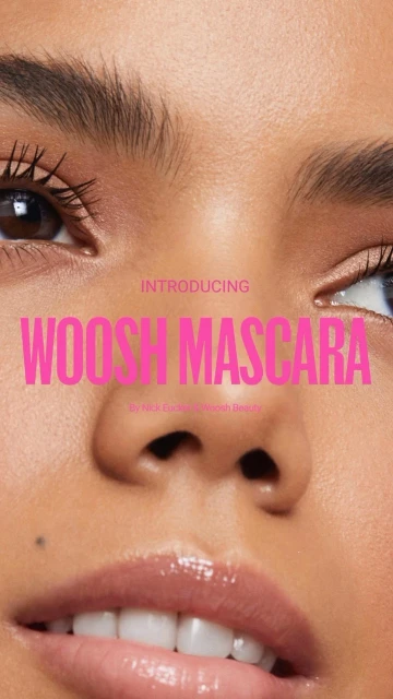 Close-up of a woman's face with focus on her eyes and lips, featuring pink text overlay advertising Woosh Mascara, promoting a beauty product.