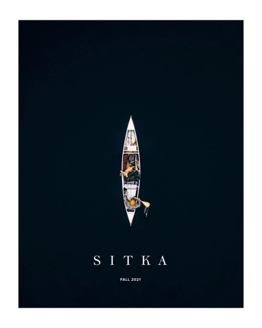 Aerial view of two people in a canoe on dark water, creating a serene scene. The canoe is centrally placed, with clear text overlay.