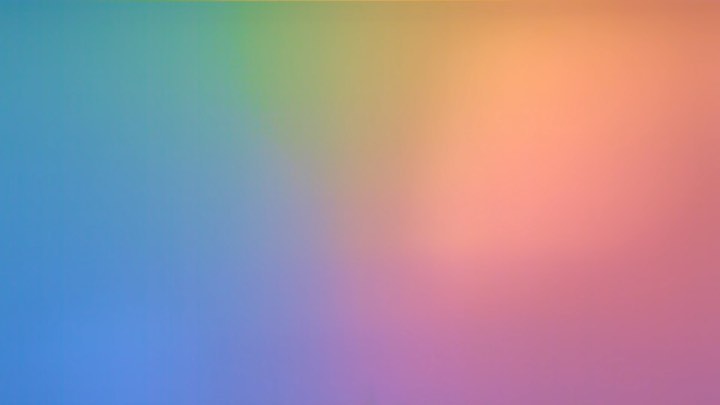 Abstract gradient background with blending hues of blue, purple, green, orange, and pink creating a soft, blurred pastel aesthetic.