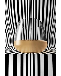 Clear stemless wine glass filled halfway with golden liquid against a distorted black and white striped background.