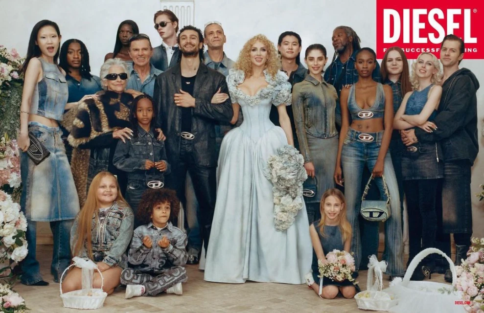 Diverse group of people in a brightly lit indoor fashion campaign, featuring adults and children wearing denim with Diesel branding.