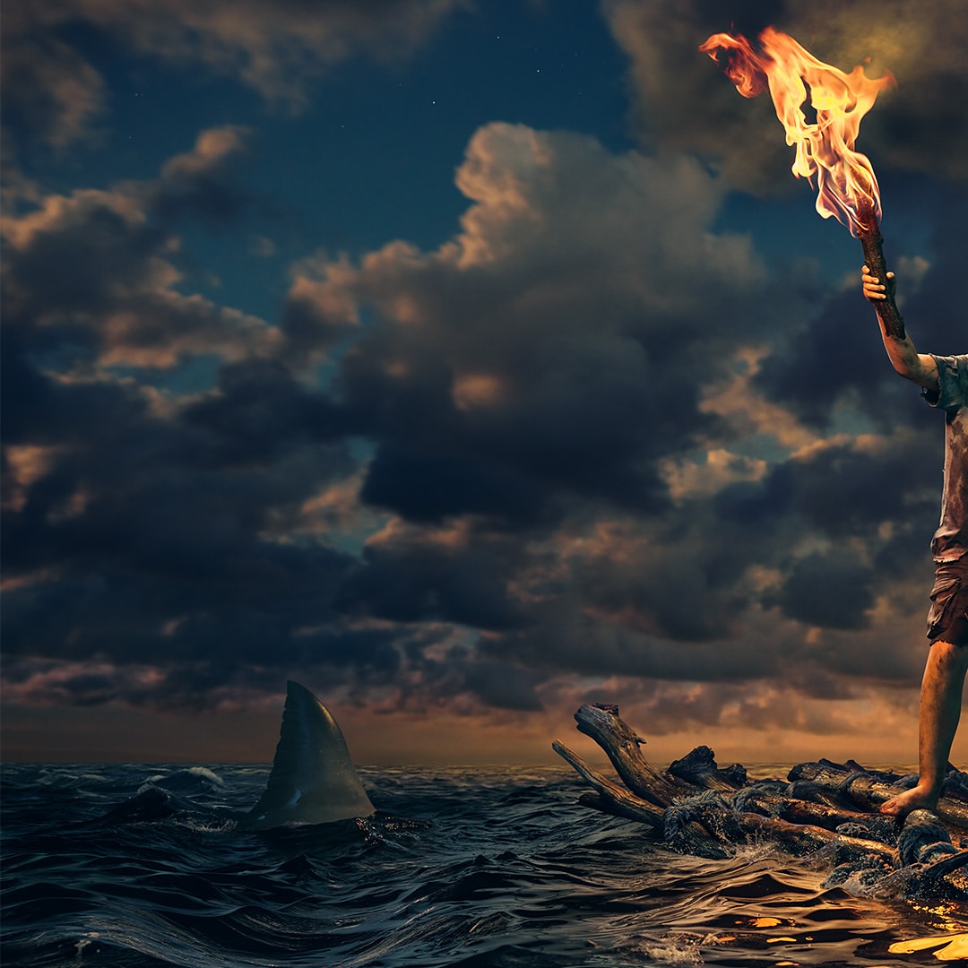 Person holding torch on makeshift raft at night, shark fin visible, dramatic sky, concept of survival, resilience, and resourcefulness.
