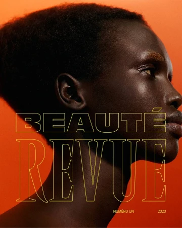 Close-up profile portrait of a black woman with short hair against an orange background by Nicolas Kantor.