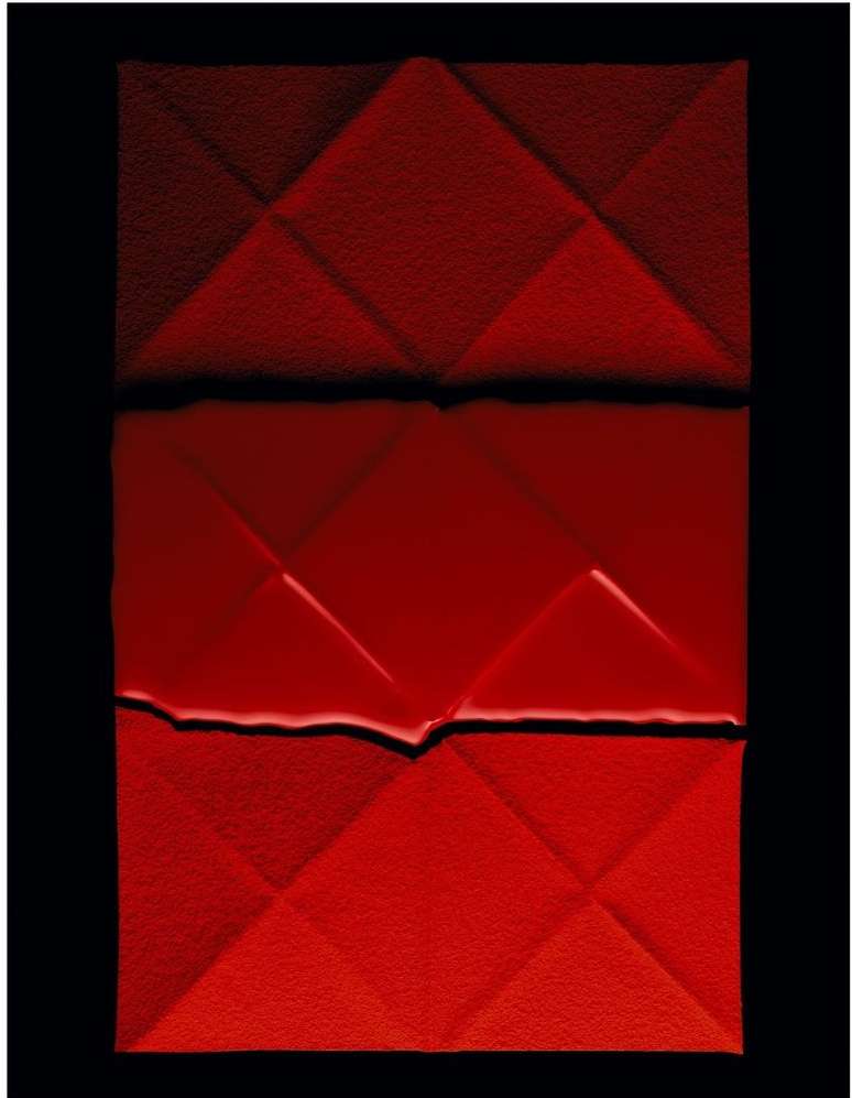 Abstract photograph of a folded red textured paper with geometric diamond pattern and black shadows on a dark background.