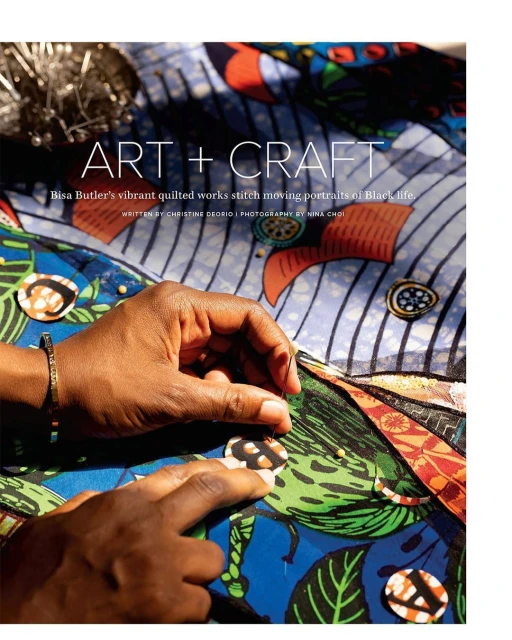 Close-up of hands sewing colorful patterned fabric with needle. Art and craft project featuring detail of stitching and textile work.