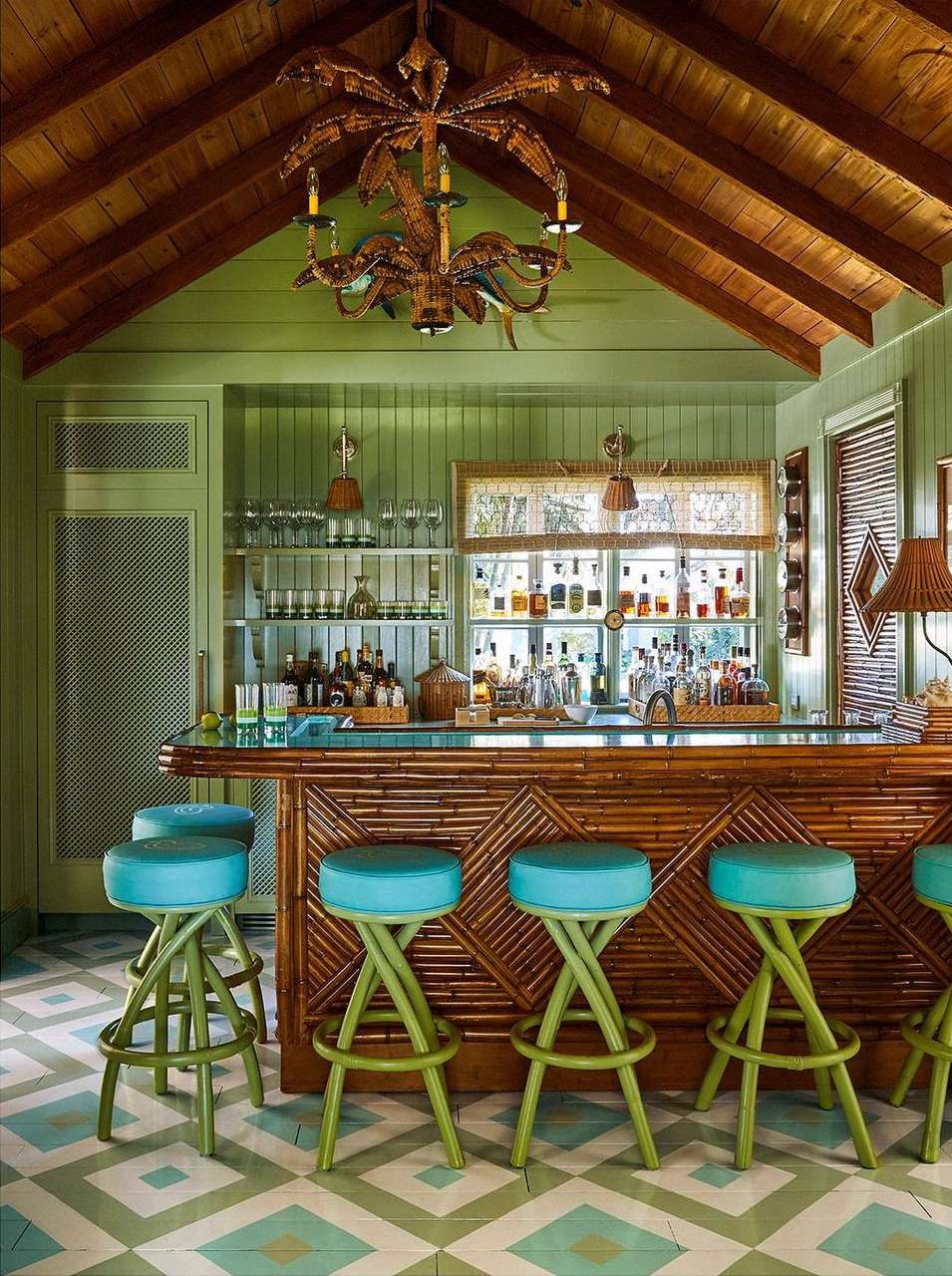 Indoor bar area with high stools, liquor bottles, wood paneled walls and ceiling, and diamond patterned floor tiles.