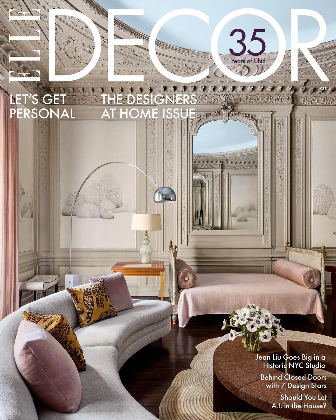 Elle Decor cover featuring a living room with a curved sofa, patterned pillows, and a daybed, showcasing interior design and home decor.