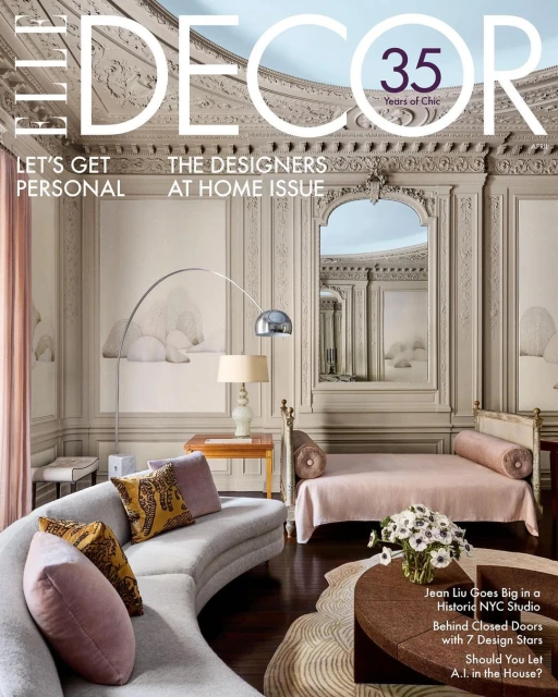 Elle Decor cover featuring a living room with a curved sofa, patterned pillows, and a daybed, showcasing interior design and home decor.